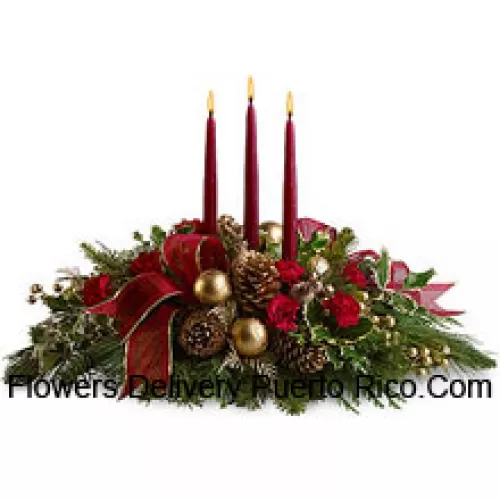 Red miniature carnations, pinecones, golden ornament balls, faux berries and assorted fresh evergreens? accented with a wired ribbon are arranged in a?low dish?with three red taper candles. (Please Note That We Reserve The Right To Substitute Any Product With A Suitable Product Of Equal Value In Case Of Non-Availability Of A Certain Product)